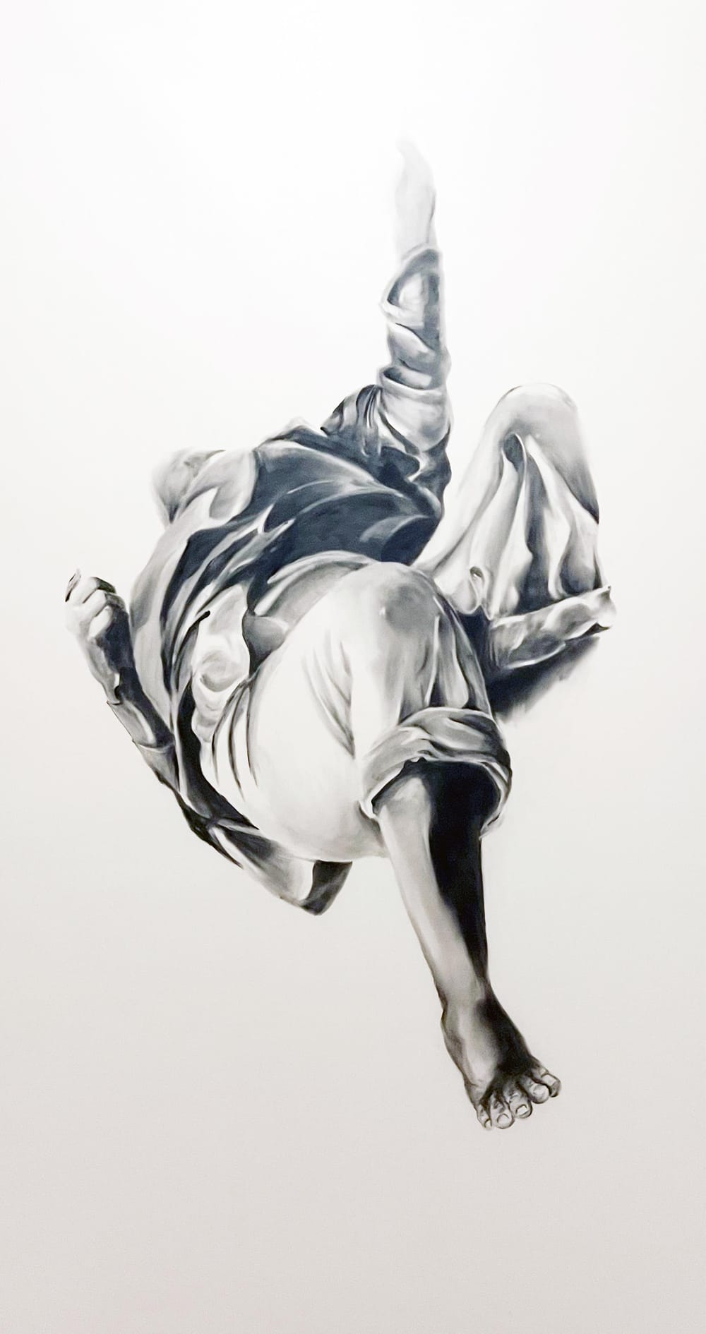 Rendered in charcoal, a single flailing human figure falls horizontally through white space, knees facing the viewer.