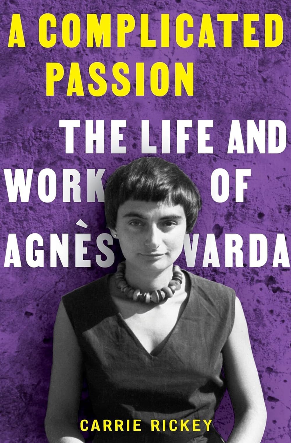 Book cover. Agnès Varda isolated against a textured purple background, the title and subtitle behind her in yellow and white