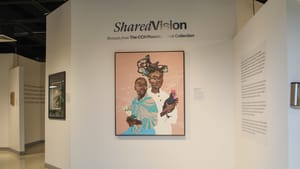 Gallery view with large fanciful portrait of 2 Black people on a peach field, one holding a chicken, the other a white flower