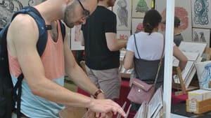 Browsing at Art for the Cash Poor. (Photo courtesy of InLiquid.)