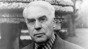Vintage black & white photo of Albert Barnes taken in 1940. He poses in a suit coat with a serious expression.