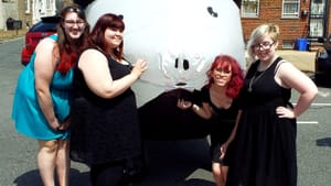 Emily Eggly, Shannon Jones, Jessica Clark, and Emily Phillips pose with Alfred Pork Chop. Image via Phillypuff.org.