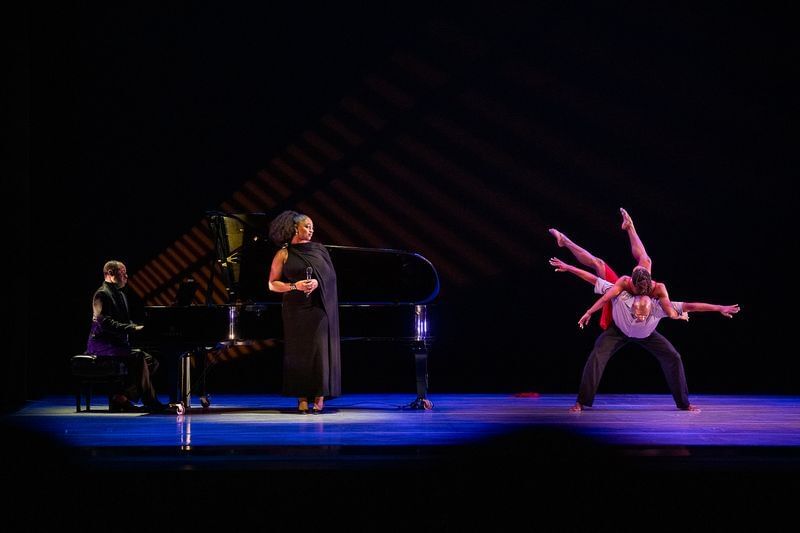 With piano player & singer in black at left, Harris rolls across Lebrun’s back as he bends forward, limbs gracefully extended