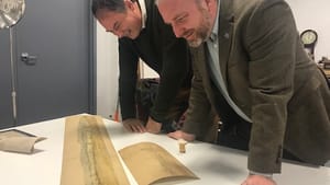 Drs. Stephenson and Mead get up close and personal with L'Enfant's watercolor. (Photo courtesy of the Museum of the American Revolution.)