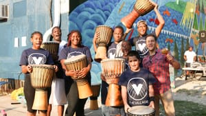 Drummer Andrés Cisneros and students. Photo by Melissa B. Skolnick.