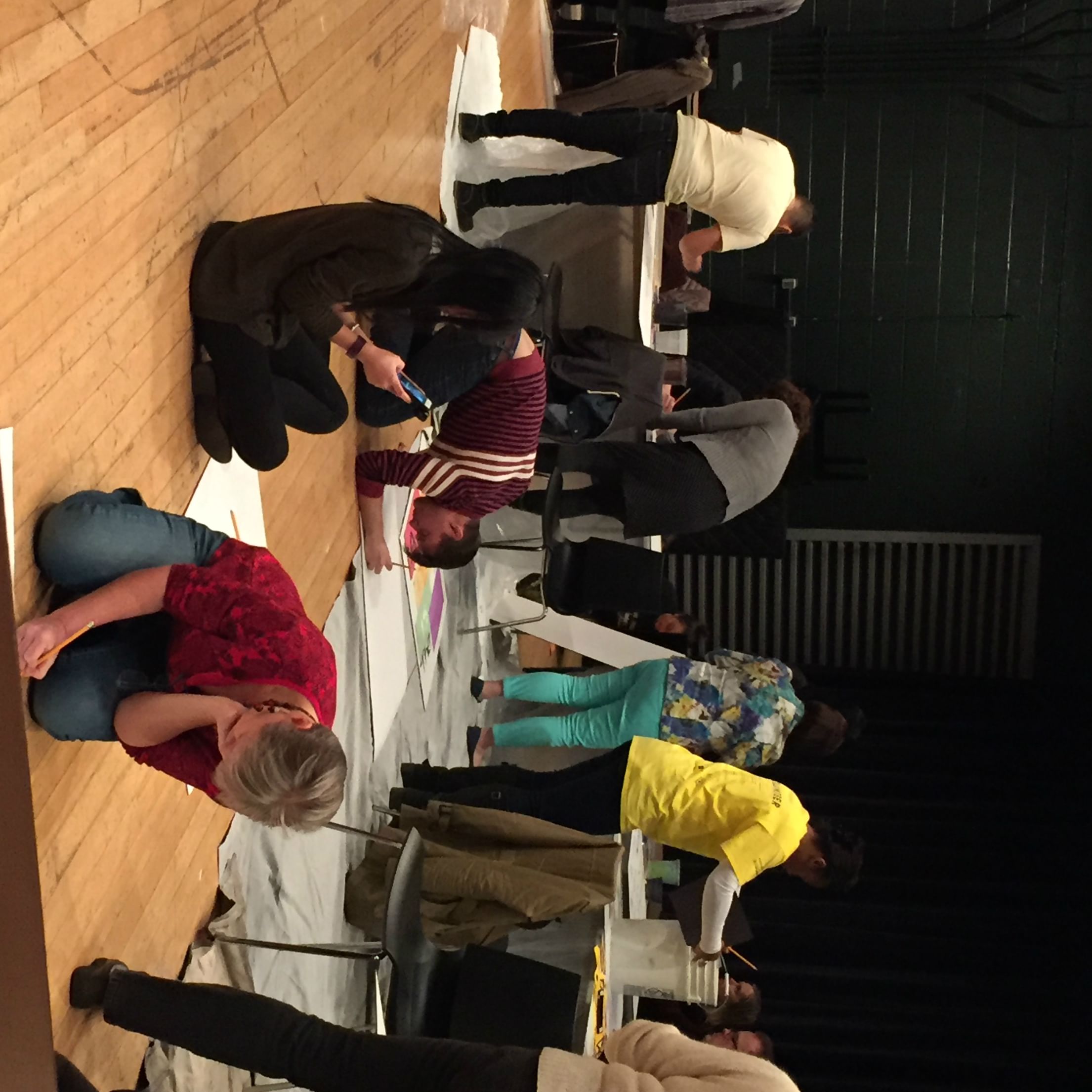 Art of the Protest participants create their signs at the March 24 workshop. (Photo by Naomi Orwin.)