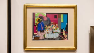 Gold-framed collage-like painting in blue, pink, black, and green, featuring two Black figures, described in text below.