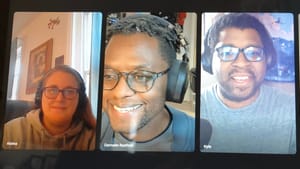 Screengrab of the podcast recording with each face in one fourth of the screen. We're all wearing headphones and smiling.