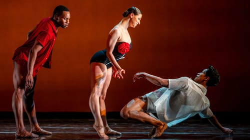 Like mechanical dolls in profile, Kelly and Green lean over Palazo, who bends gracefully backward over the floor, surprised