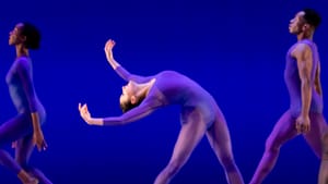 In a blue leotard, with feet planted wide, Barbosa bends sinuously back, her arms completing a dramatic S-curve.