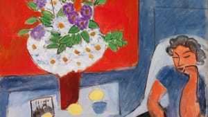 A stylized woman sits in a chair next to a large flower bouquet, a book in her lap and her cheek leaning on one hand.