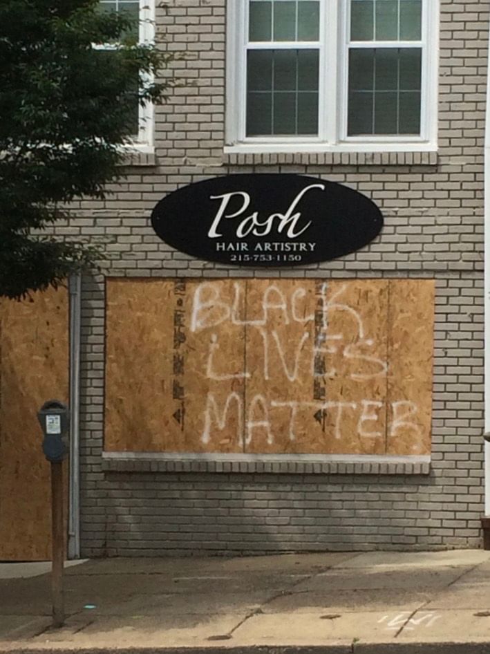 During the protests that sprang up in early June, Germantown Avenue shops showed their solidarity. (Photo by Anndee Hochman.)