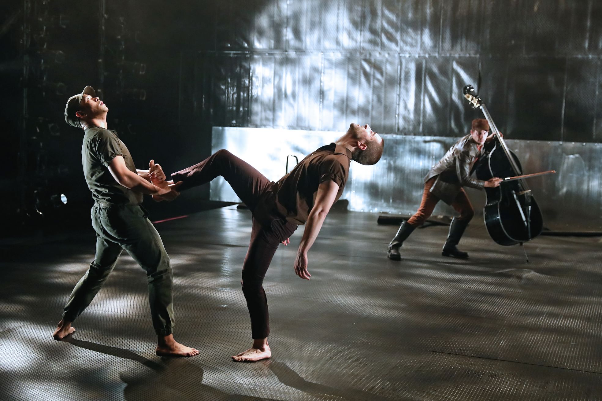 L to R: Justin Jain, Matteo Scammell, and Ross Beschler perform extreme choreography. (Photo by Bill Hebert.)