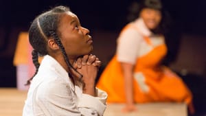 Jasmine Ward's Pecola prays for blue eyes in the Arden's production. (Photo by Mark Garvin.)