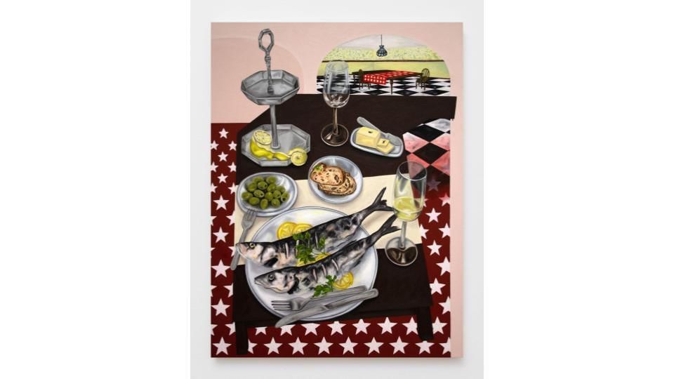 A grilled fish meal with butter, parsley, lemon, olives, bread & wine on a black table, on maroon background with white stars