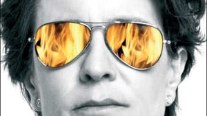 Book cover. Black & white close-up on Swisher’s impassive face, wearing aviator sunglasses that reflect orange flames.