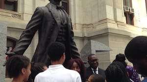 Children gather at the base of City Hall's new Octavius Catto statue. (Photo by Alaina Johns.)