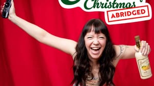 The show flyer. Schoonover, in a silver sequined dress, holds a TV remote and a bottle of eggnog, yelling joyfully
