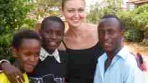 Davis with 'her' kids in Kigali (Christian at right): What makes them smile?