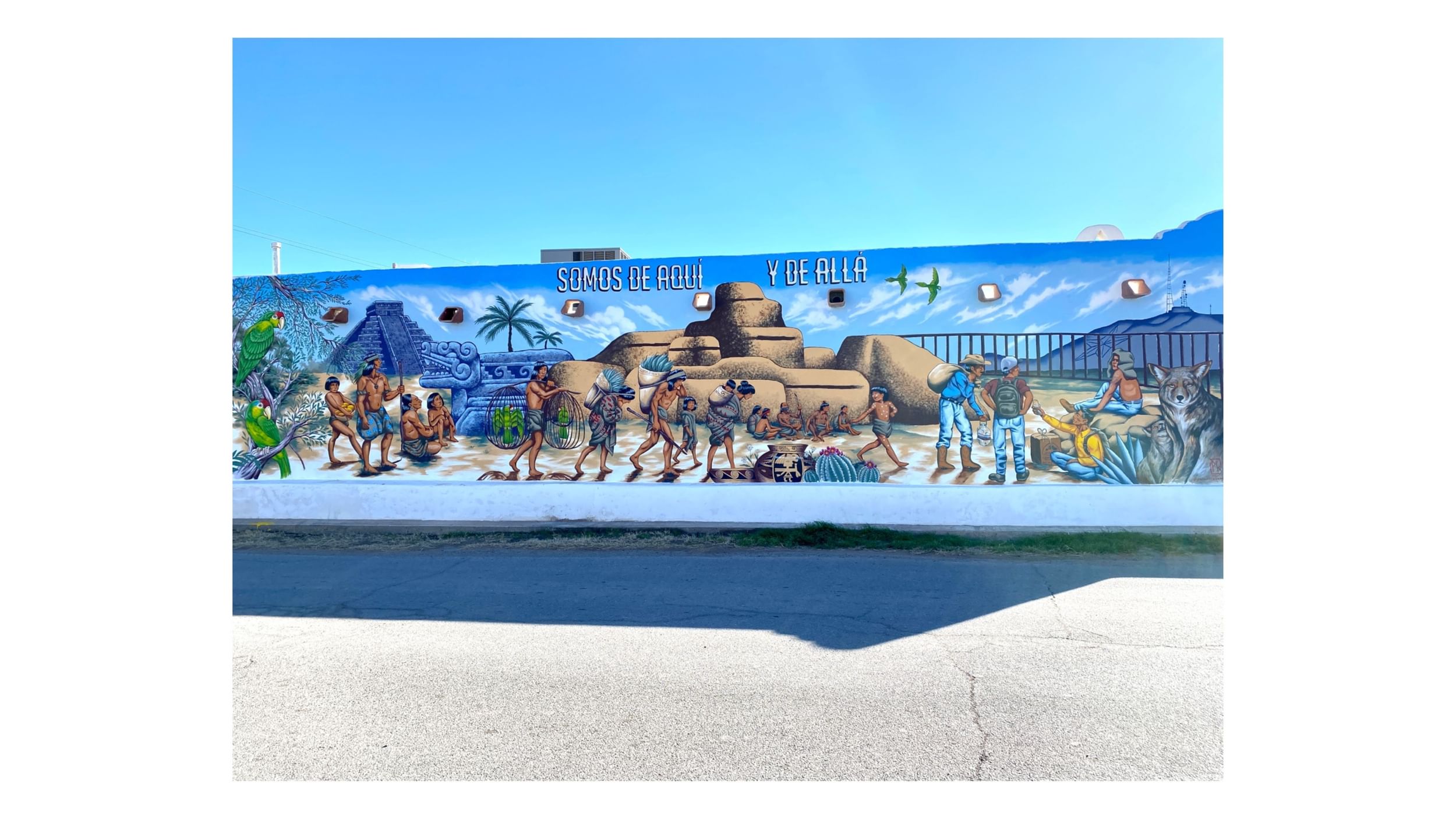 A colorful mural features images of native El Pasoans and local Indigenous people, both historical and contemporary.