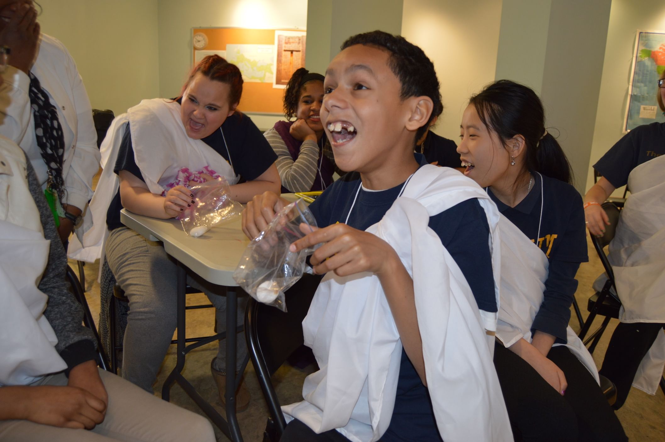 Students from an Autistic Support class at H.A. Brown inspect a papier-mache desiccated mummy in the Penn Museum's Mummy Makers workshop. (Photo by Emily Hirshorn)