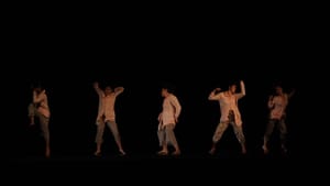 Five dancers in pajama-like outfits strike different dance moves in dim light on a dark stage.
