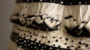 Silk, rayon, glass, and pheasant feathers on a stripped black and ivory evening gown
