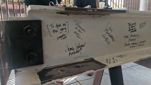 To God be the glory: Faith and Liberty Discovery Center supporters sign its final steel beam. (Photo by Kyle V. Hiller.)