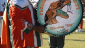 Beating the drum, and each other.
