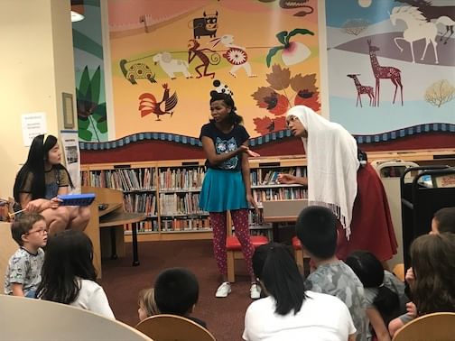 L to R: Amy Boehly as Ty, Kishia Nixon as Azsori, and Aneesa Neibauer as Ms. Layla the Librarian. (Photo courtesy of Dragon's Eye Theatre.)