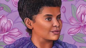 The book cover. Title above in white script, with a smiling portrait of a young Wells on a floral purple background