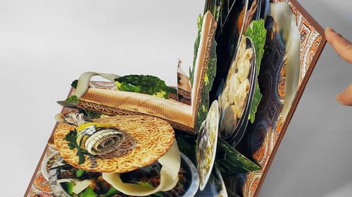 A pop up book features various Uyghur foods and dishes.