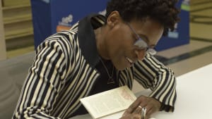 'Another Brooklyn' author Jacqueline Woodson signs at the Free Library. (Image via the Free Library.)