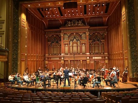 The Boston Modern Orchestra Project records with oboist Erin Hannigan and conductor Gil Rose in Jordan Hall. (Image courtesy of BMOPsound.org.)