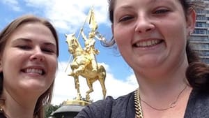 Sarah Young (Agnès Sorel) and Gillian Watson (Joan of Arc), the Tuesday 6/24 principals of "The Maid of Orleans," take a selfie in front of St. Joan of Arc Statue on the Parkway in Philadelphia.