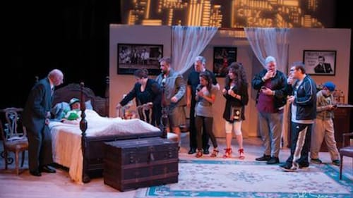 The cast of "'Johnny" Schicchi,' L to R: Dave Perelman, John Rudolph (in bed), Tiffany Nack, Andrew Shaw, David Price, Elizabeth Oliver, Andrea Broido, Brian McKay, Zachary Sigafoes, and Henry Parson. (Photo by John Sturgis Photography.)