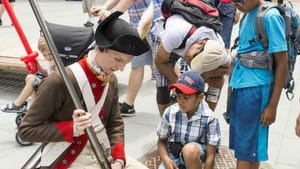 A reenactor greets Independence Day visitors. (Photo courtesy of the Museum of the American Revolution.)