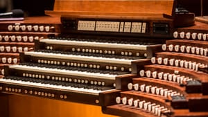 A closeup shot of the keys on an organ