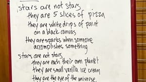 A fourth-grade classroom photo of a whiteboard with a collaboratively written poem about stars hand-written in black marker.