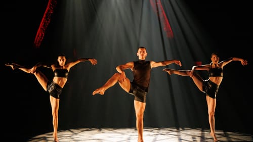 3 dancers in tight black outfits strike the same pose: balanced on one leg with the other arcing up, one hand on that knee