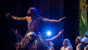 Prosperity returning: James Ali Wilkie as Ogun, with Yusuf Young and the Kulu Mele ensemble. (Photo by Jaci Downs photography.)