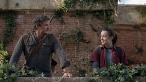 An adult man and young woman-presenting character outside at a balcony, wearing dark grays and browns, look at each other