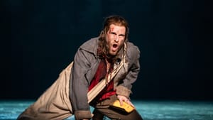 Les Mis hero Jean Valjean, with long hair and grimy 19th-century clothes, kneels on the stage and sings passionately.