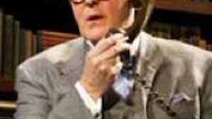 Lithgow as Alsop: Extinct breed of super-pundit.