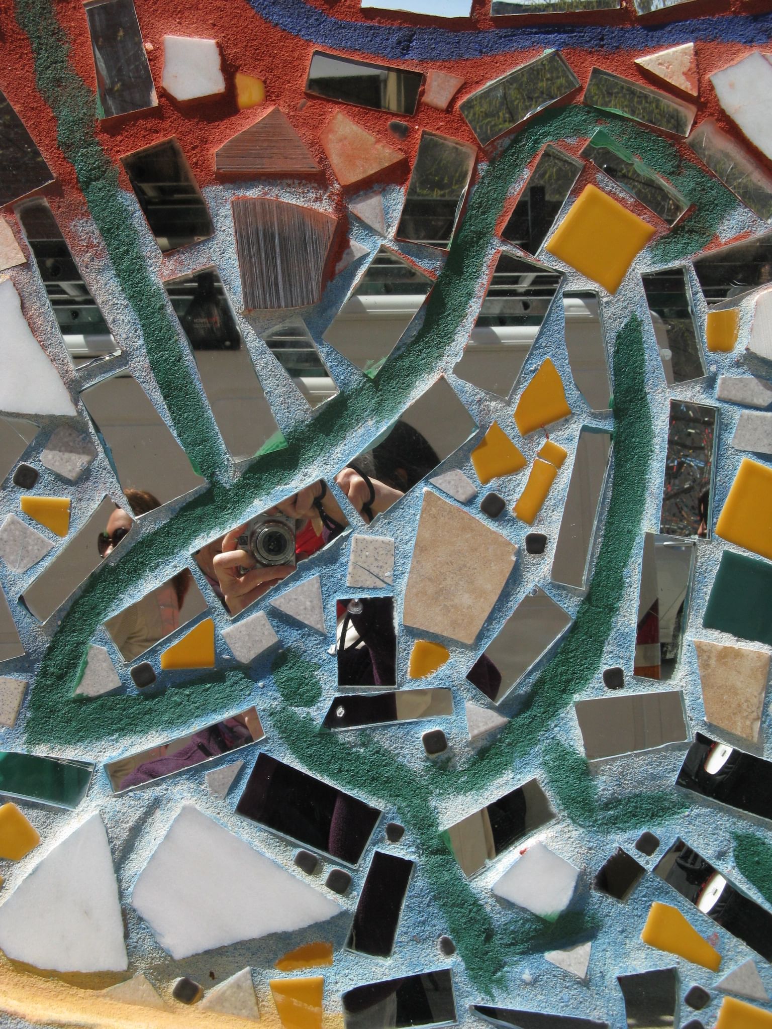 Mirrored tiles reflect viewers back to themselves.