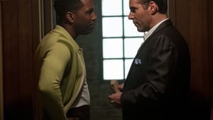 Leslie Odom Jr. and Alessandro Nivola face each other in profile in a scene from the movie.