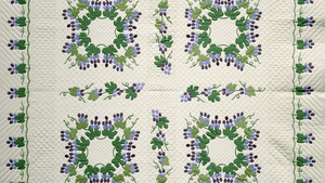 'Grapes and Vines,' by Mary Schafer, c. 1972. Cotton with Polyester Batting, 88 x 98. Mary Schafer’s 'Grapes and Vines' is patterned after a quilt pictured in Marie Webster’s classic 1915 book, Quilts. The intricate appliqué design was a trademark of Webster’s work. Schafer received the pattern from the estate of Betty Harriman in 1971. (Photo by KEVA, all rights reserved, Michigan State University Museum.)