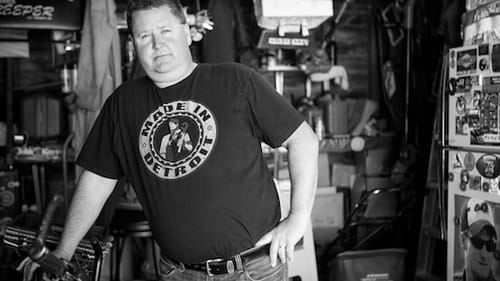 Bill, one of the guests who "joins" exhibit-goers at the table via photographs and voiceover, laments, "People don't realize what you've got until it's gone." (Photo by Barbara Grover, 2016, courtesy of MAZON: A Jewish Response to Hunger)