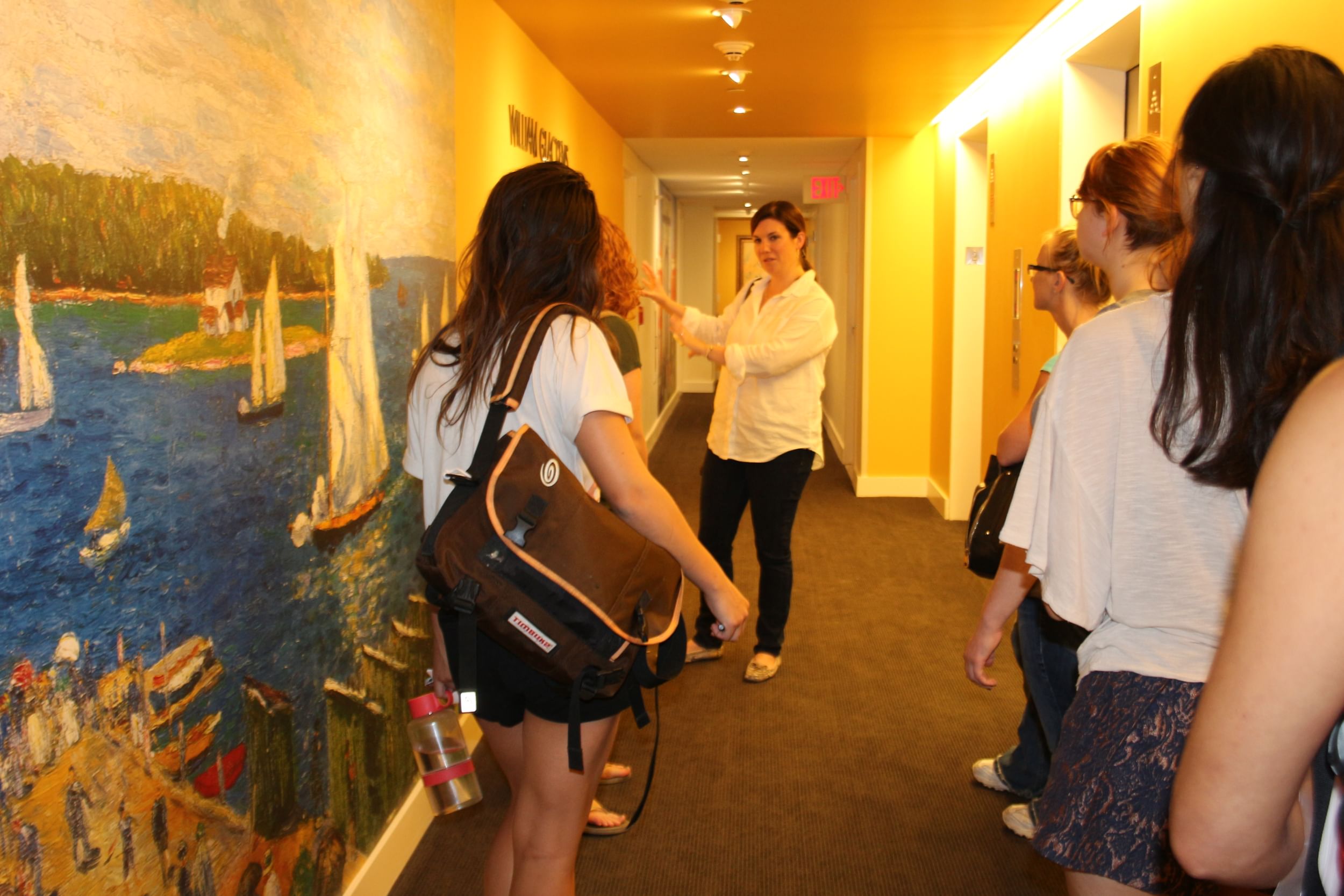 Meghan Dougovito of Tryba Architects works with Moore students at Park Towne Place. Image courtesy of Moore.