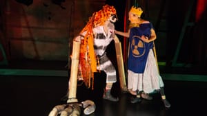 Jered McLenigan (left) and Mary Tuomanen re-enact the ancient tale of the yellow boy and his orange-haired stalker. (Photo by Johanna Austin, austinart.org.)